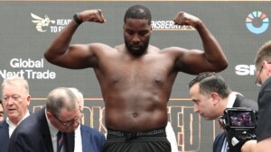 Lawrence Okolie weighs in a tank for his fight on the Usyk vs Dubois 2 undercard
