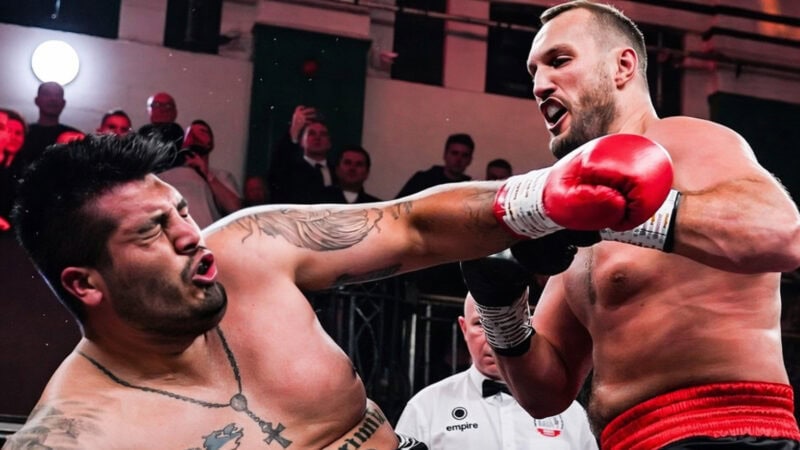 Nelson Hysa lands a powerful right hand on Ariel Esteban Bracamonte during their heavyweight bout, with Bracamonte’s head snapping back