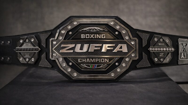 Close-up of the octagon-shaped Zuffa Boxing championship belt with diamond detailing and “ZUFFA” across the center plate