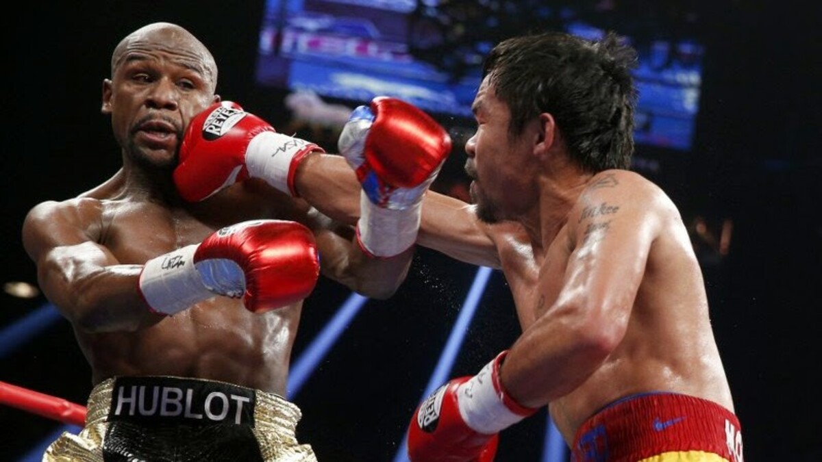 Manny Pacquiao lands a right hand on Floyd Mayweather during their 2015 welterweight fight