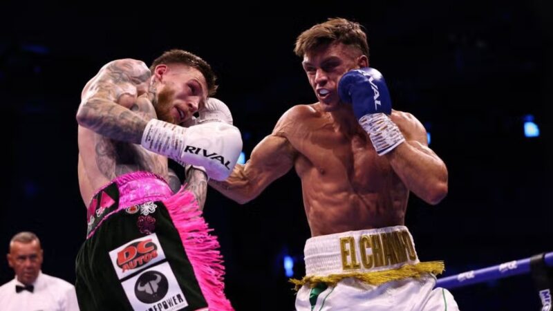 Lee Reeves lands a punch on Gary Cully during their dramatic super lightweight bout before Reeves underwent surgery following the final-round knockout